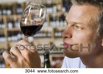 man-examining-glass_~3044.jpg