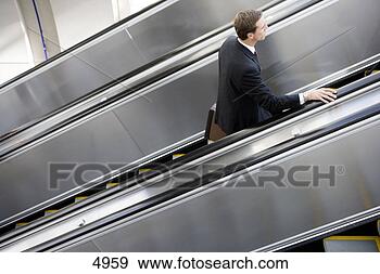 businessman-ascending-escalator_~4959.jpg